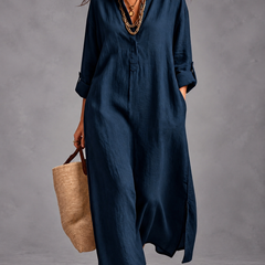 Margaret V-neck maxi shirt dress in navy with a straw bag