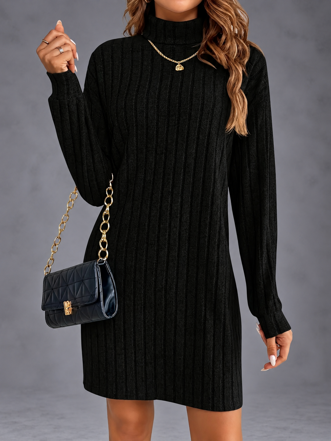 Isabella turtleneck sweater dress in black with gold accessories